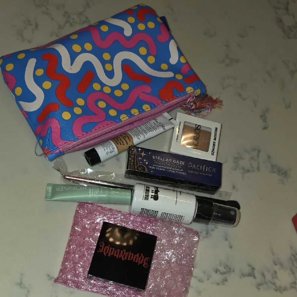 Colorful Patterned Makeup Bag with Assorted Beauty Products